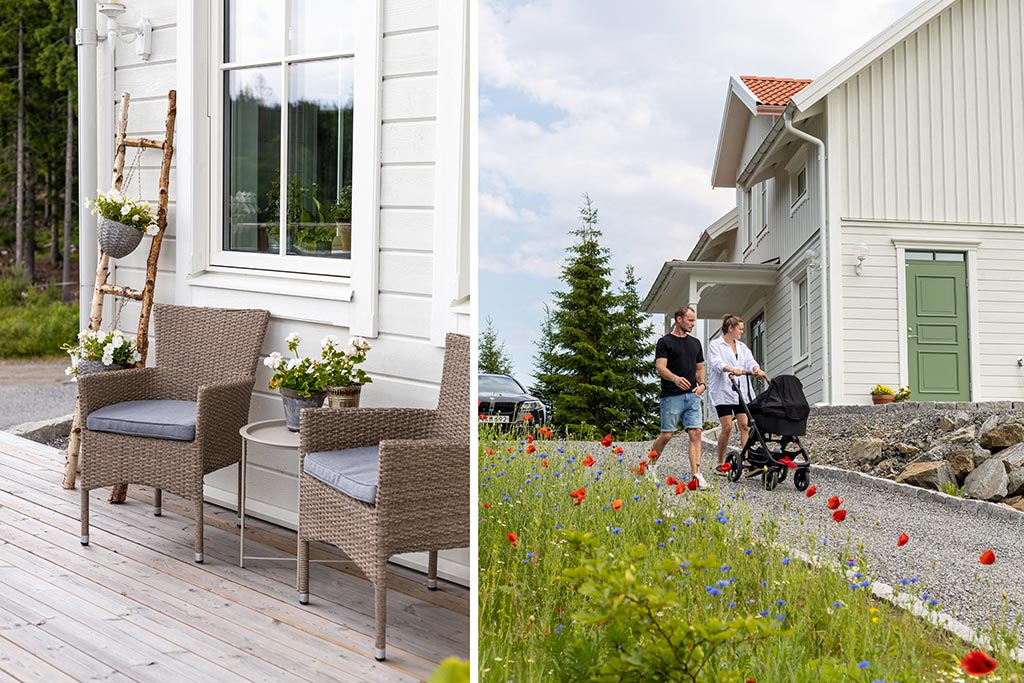 Vallmo och andra ängsblommor framför hus